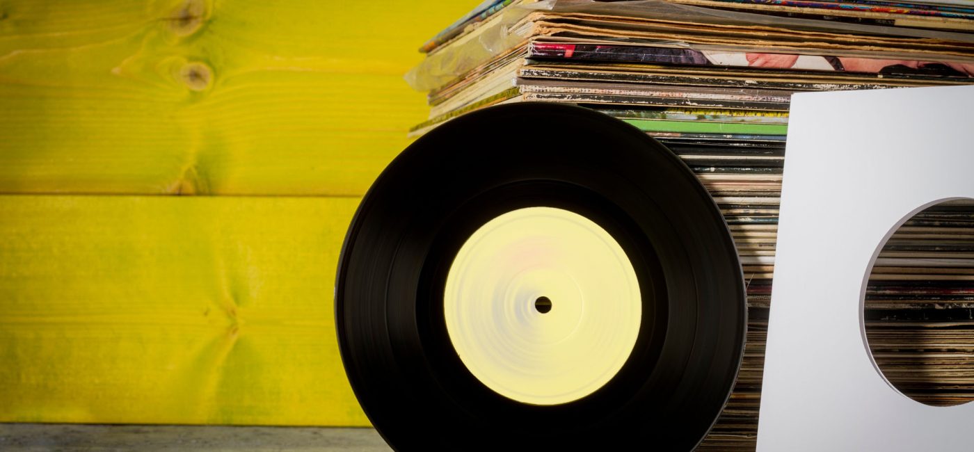 Records Stacked, One in Front